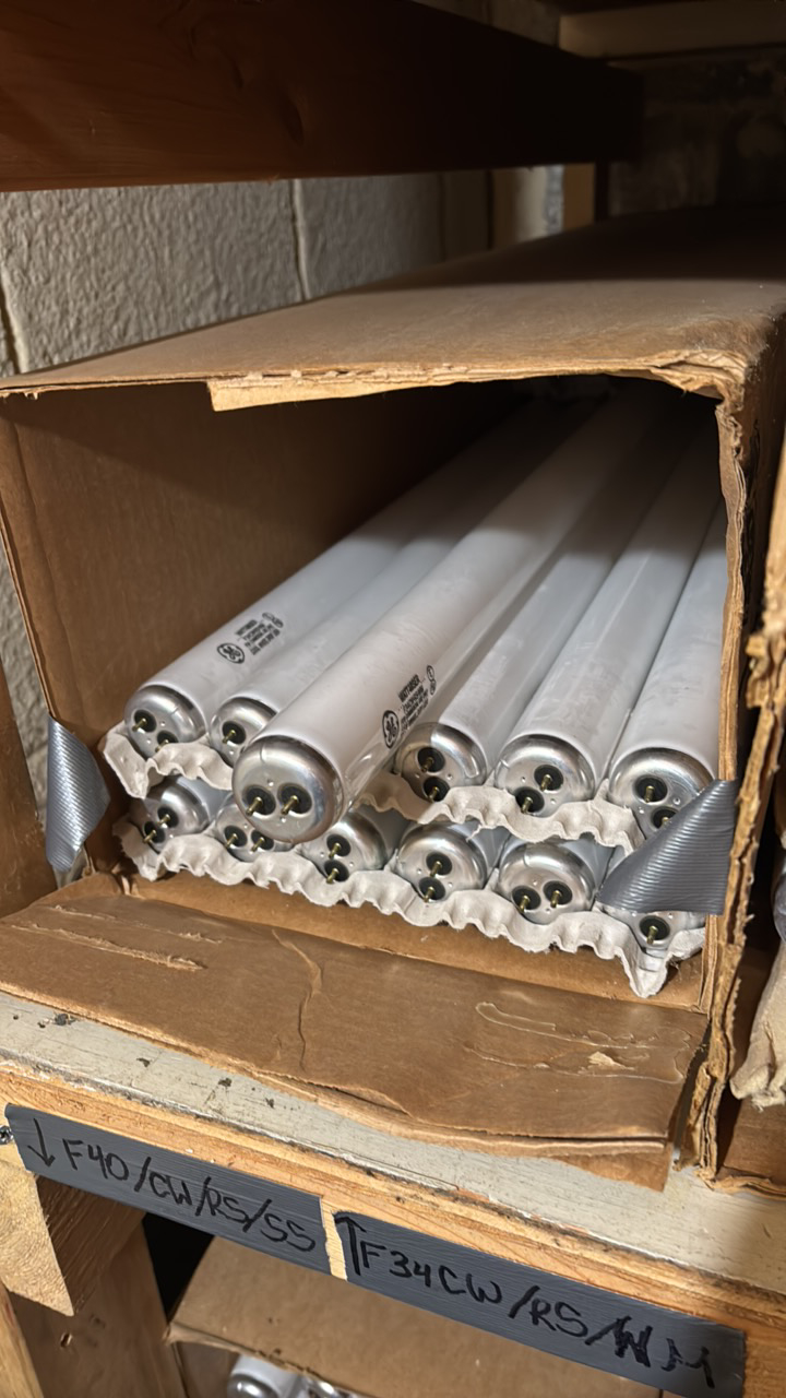 lot 136 image: Open Case of General Electric Fluorescent Bulbs, 13 Bulbs, F34CW-RS-WM Watt-Miser 34 Watts, Cool White, 48 Inches