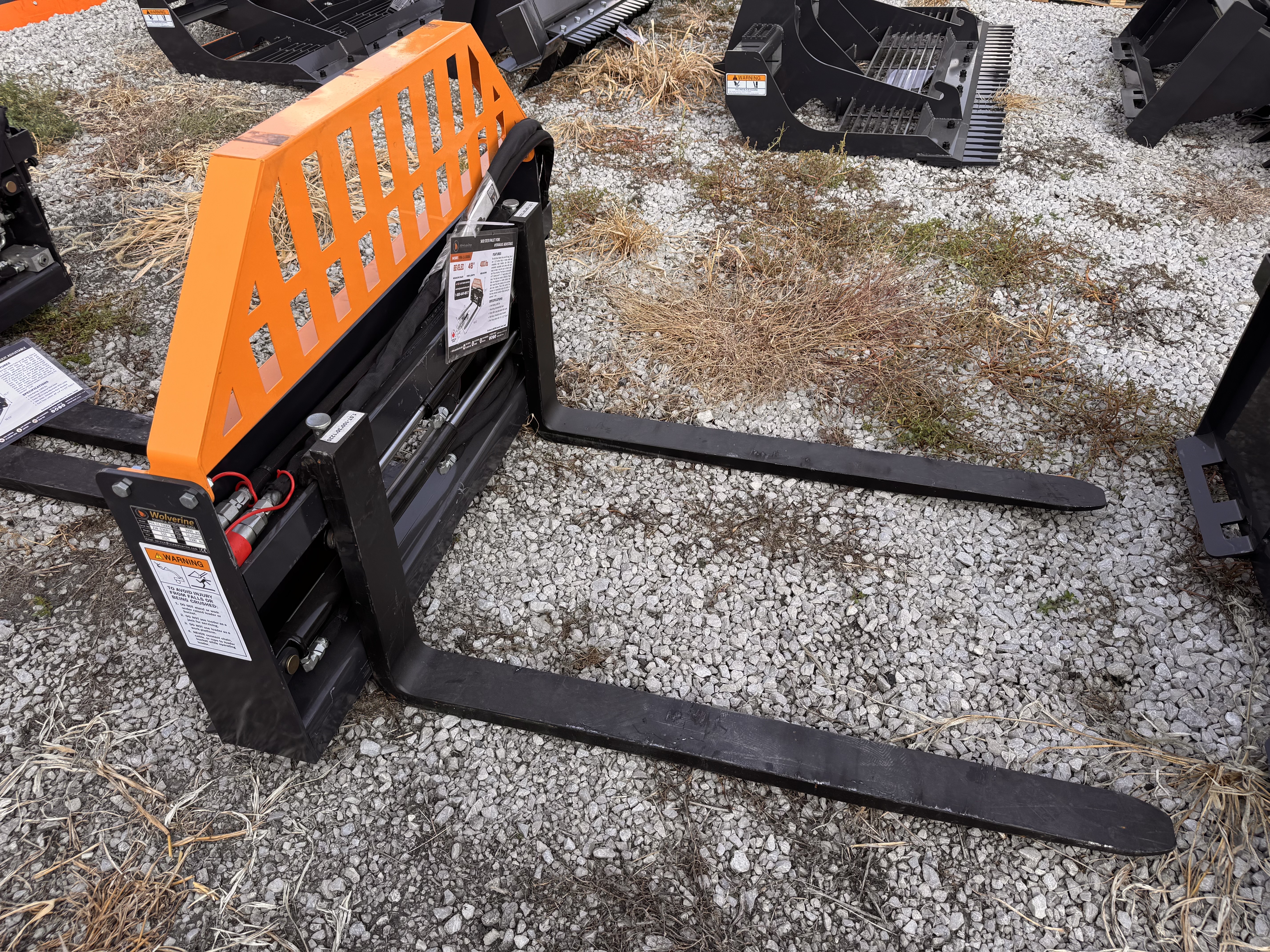 lot 22 image: Wolverine 48 Skid Steer Hydraulic Adjustable Pallet Forks
