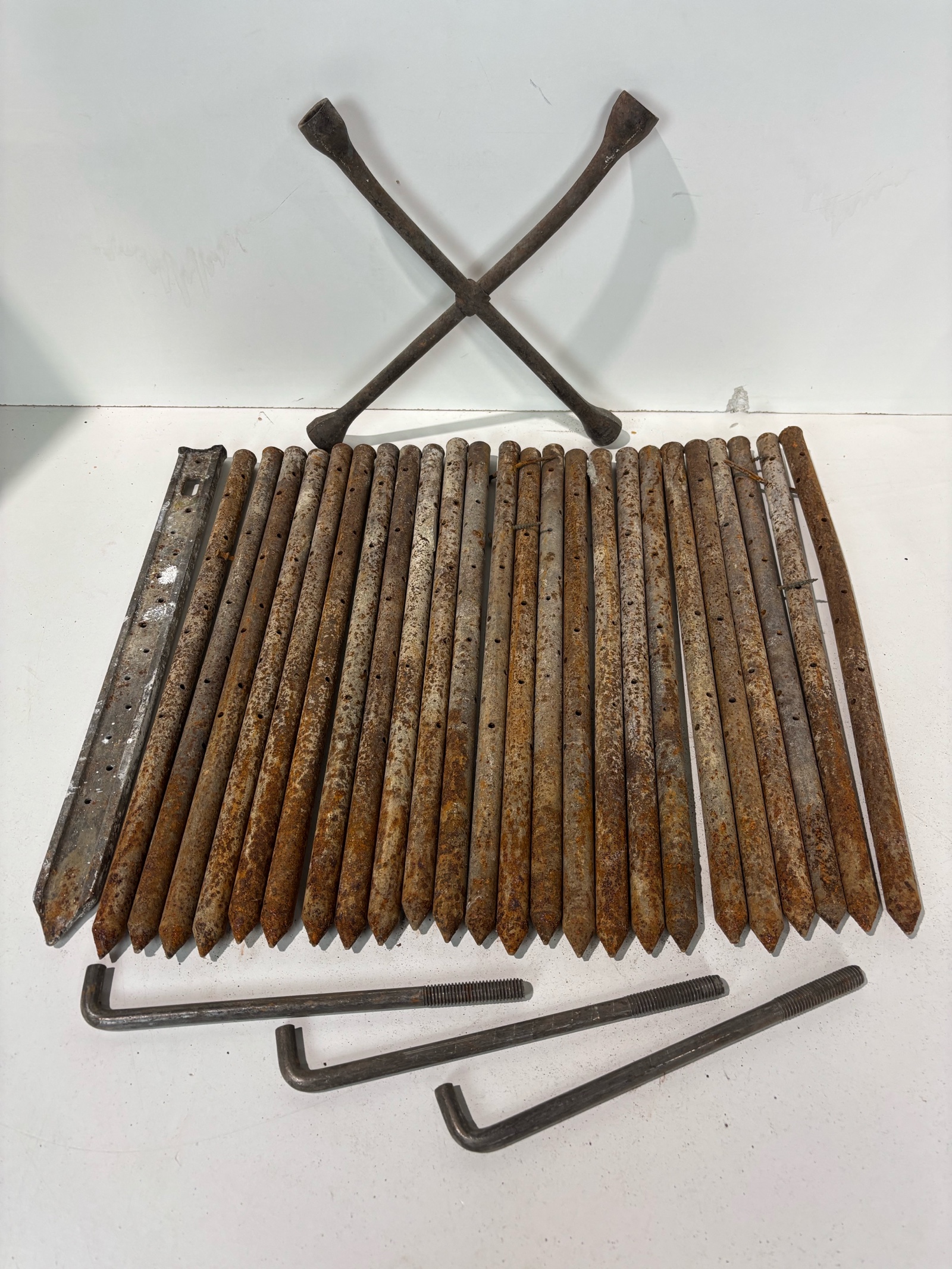 lot 91 image: Lot Of Metal Tent Stakes And A Tire Iron