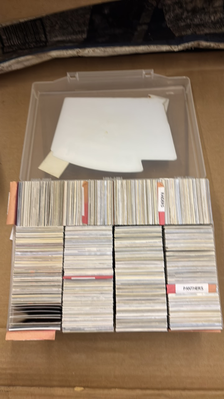lot 155 image: Big Plastic Box Filled With Football Cards, Organized by Team, Panthers, Raiders, Colts, Saints, Cardinals and Chargers, Cards are From 1990s and 2000s