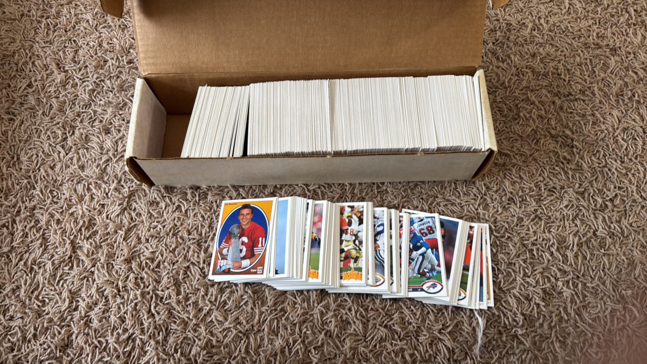 lot 179 image: 1991 Upper Deck Football Card Partial Set, Plus One Extra Joe Montana Insert Set Card, Looks like Only a Handful of Random Cards are Missing