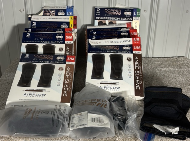 Box of Cooper Fit Knee Sleeves & Compression Socks