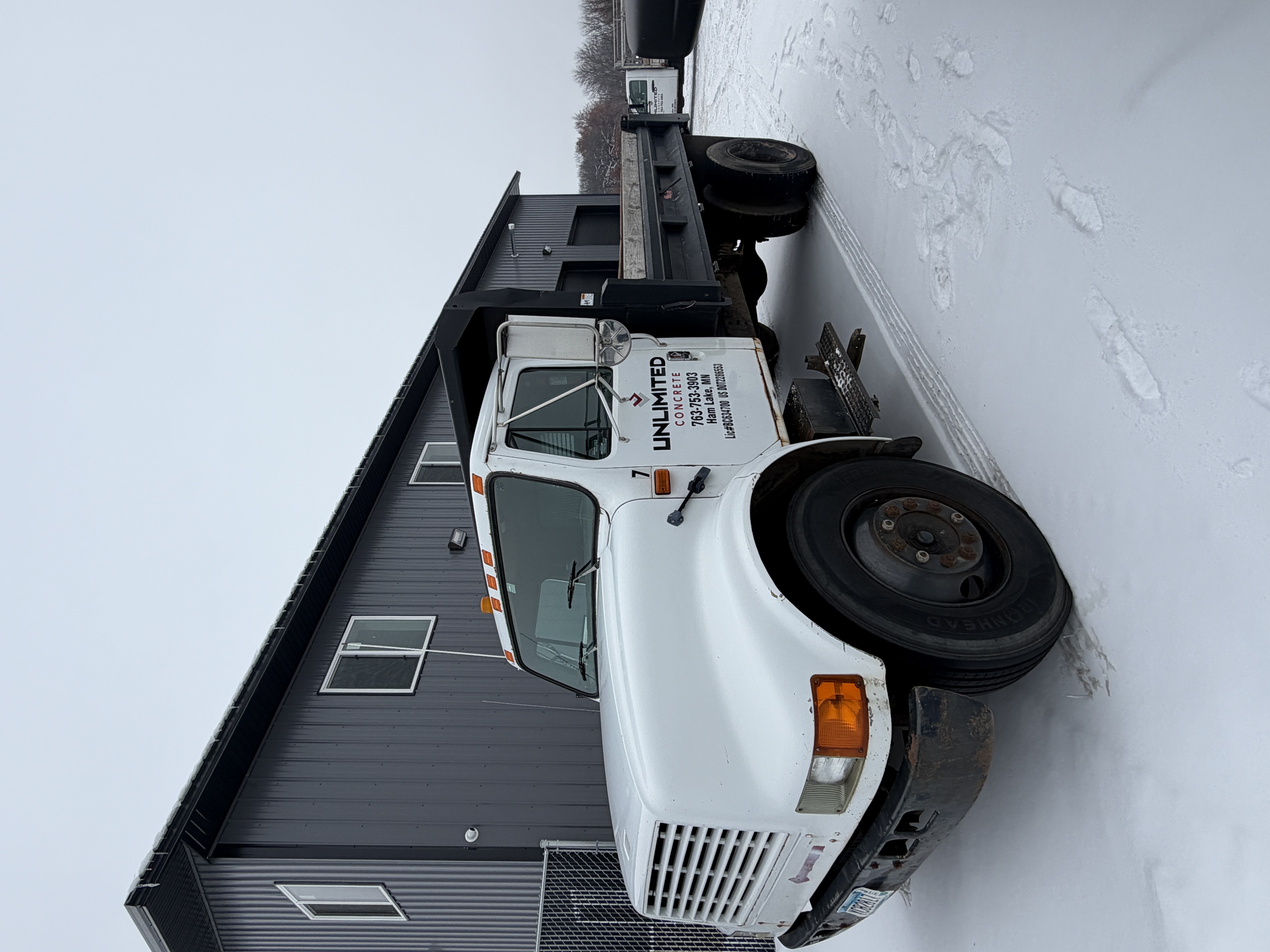 lot 12 image: 1993 International Dump Truck & extra Dump Truck hood.