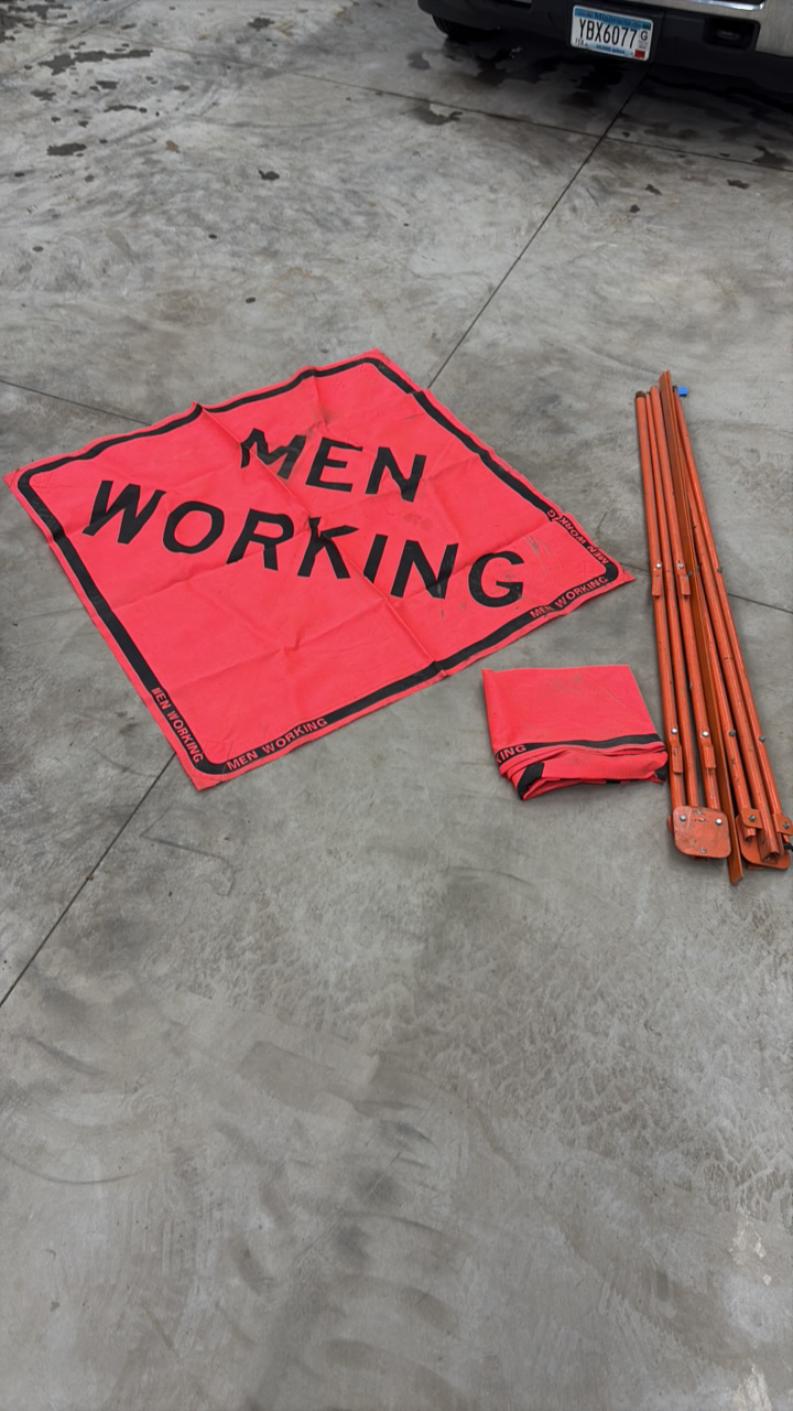 lot 42 image: (2) Men Working Roll-up signs with tripod stands