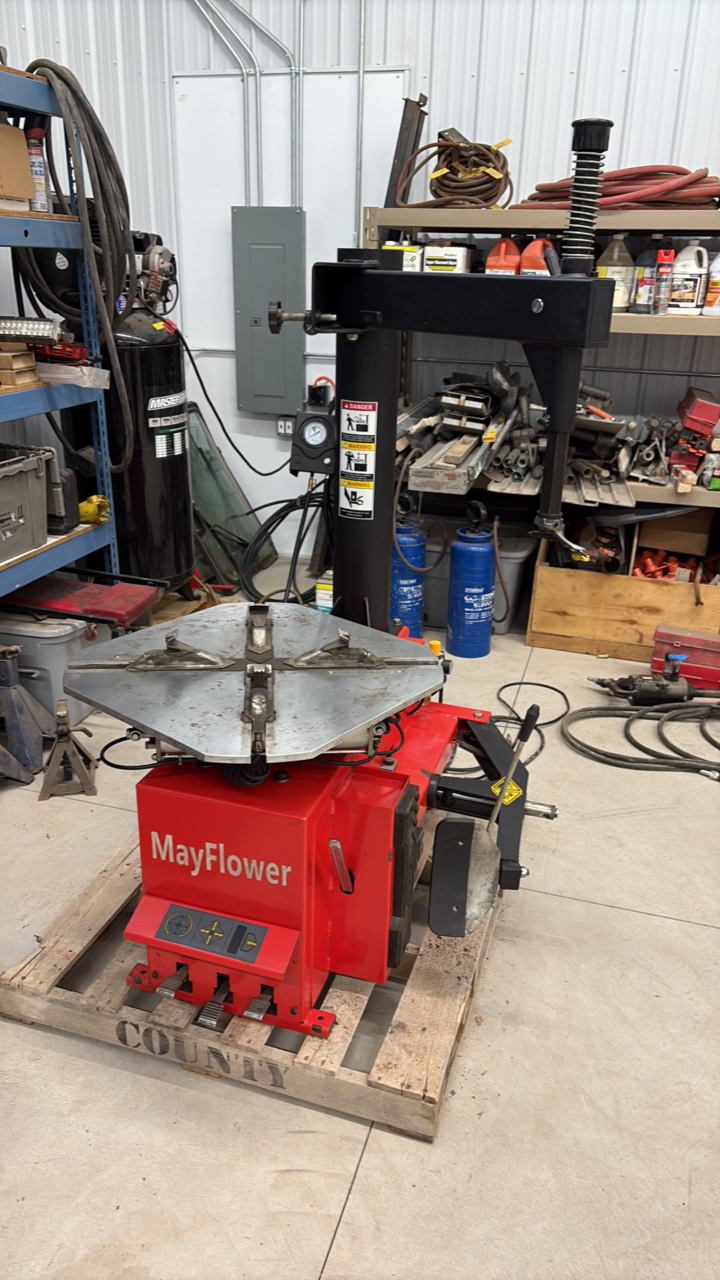 lot 6 image: Mayflower Red Tire Changer with a bead blaster.