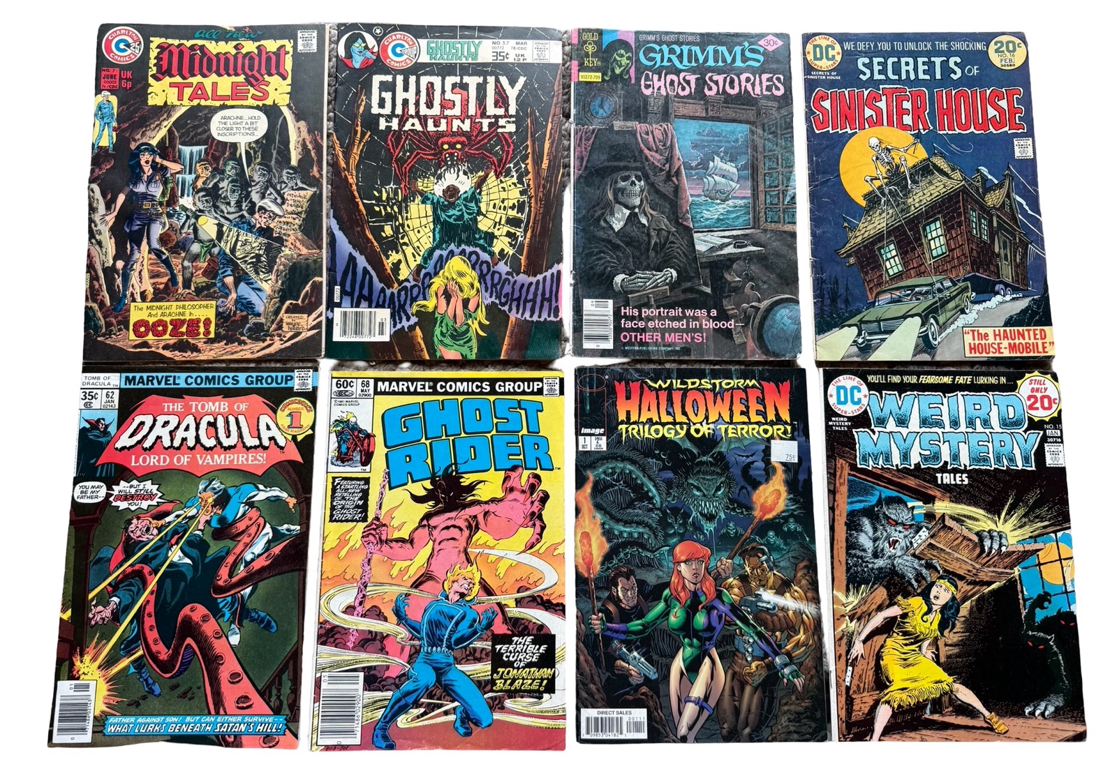 lot 119 image: Midnight Tales, Ghostly Haunts, Grimms Ghost Stories, Secrets of Sinister House, Dracula, Ghost Rider, Halloween, Weird Mystery