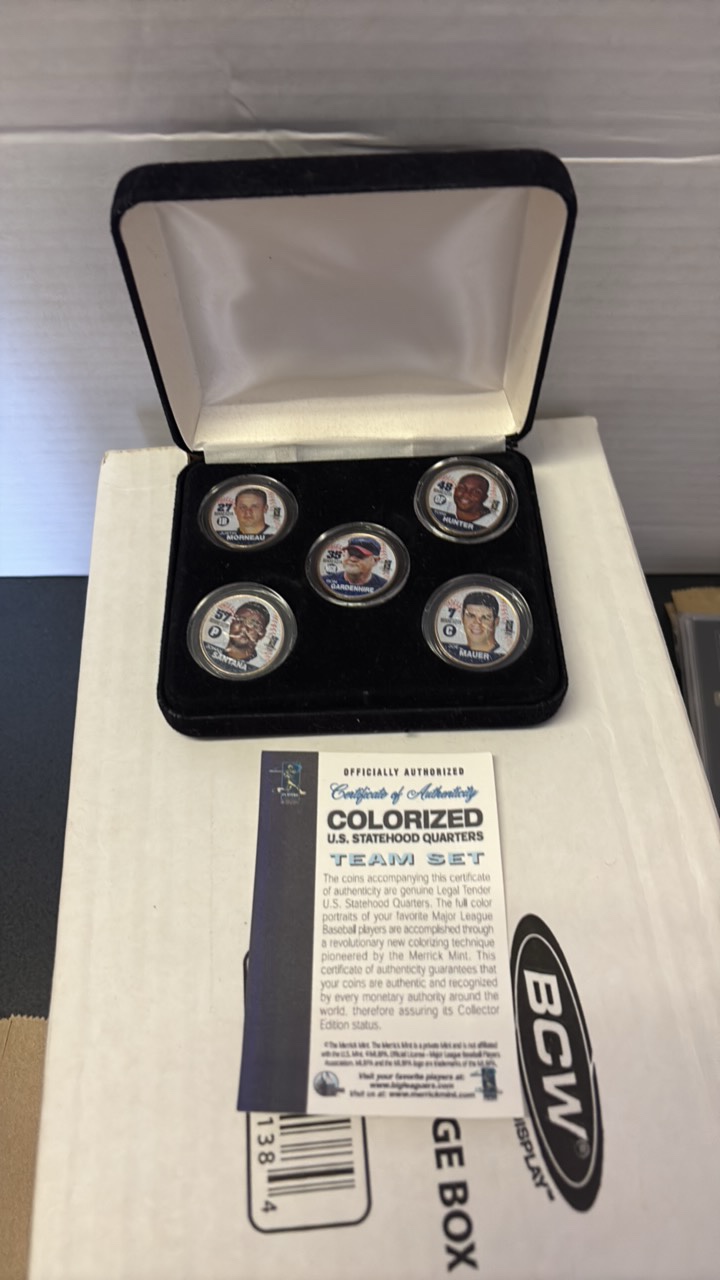 lot 188 image: Minnesota Twins Coin Team Set, Rare Colorized Minnesota Star Quarters Featuring Joe Mauer, Justin Morneau, Ron Gardenhire, Johan Santana and Torii Hunter, Comes With Original Plastic Cases and Original Box With Certificate of Authenticity