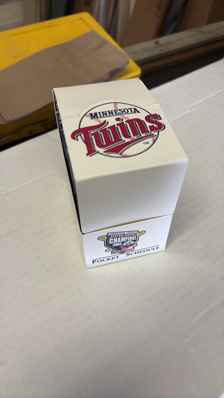 lot 190 image: Full Display Box of 2004 Minnesota Twins Pocket Schedules, Fresh Off Their 2003 American League Central Division Title