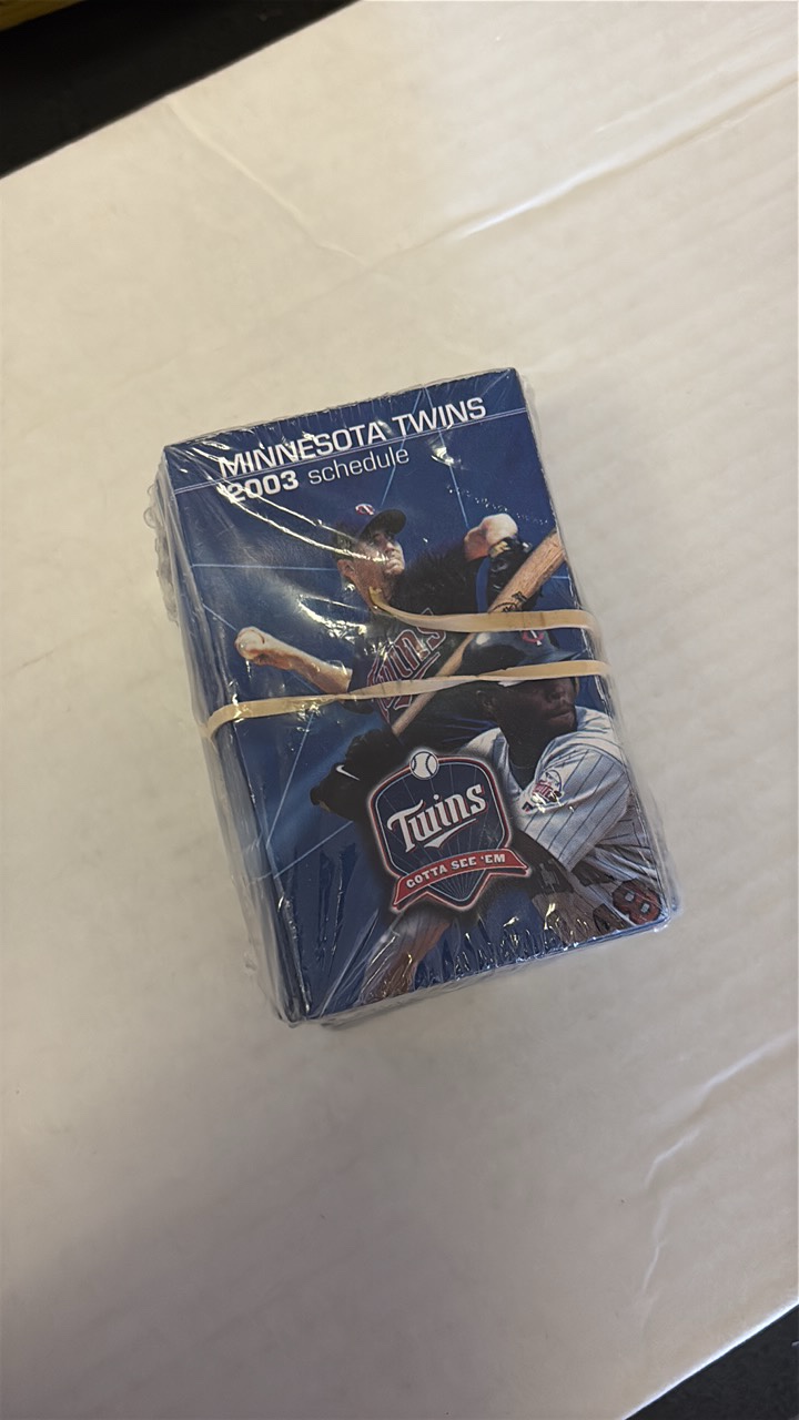lot 191 image: Sealed Stack of 2003 Minnesota Twins Pocket Schedules, The Year They Won the American League Central Division Title