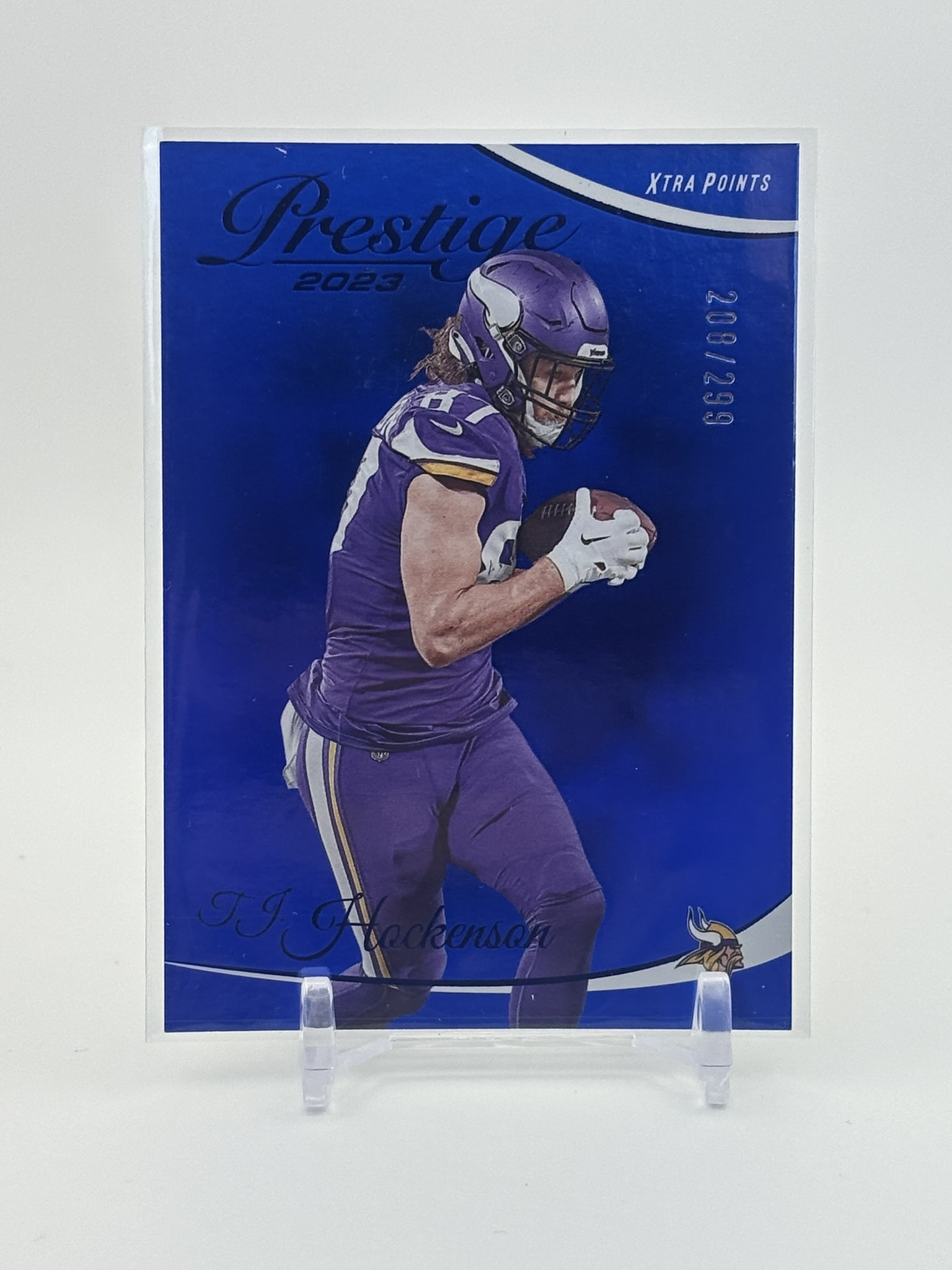 lot 665 image: 2023 Panini Prestige - T.J. Hockenson #195 Xtra Points Premium Blue 299