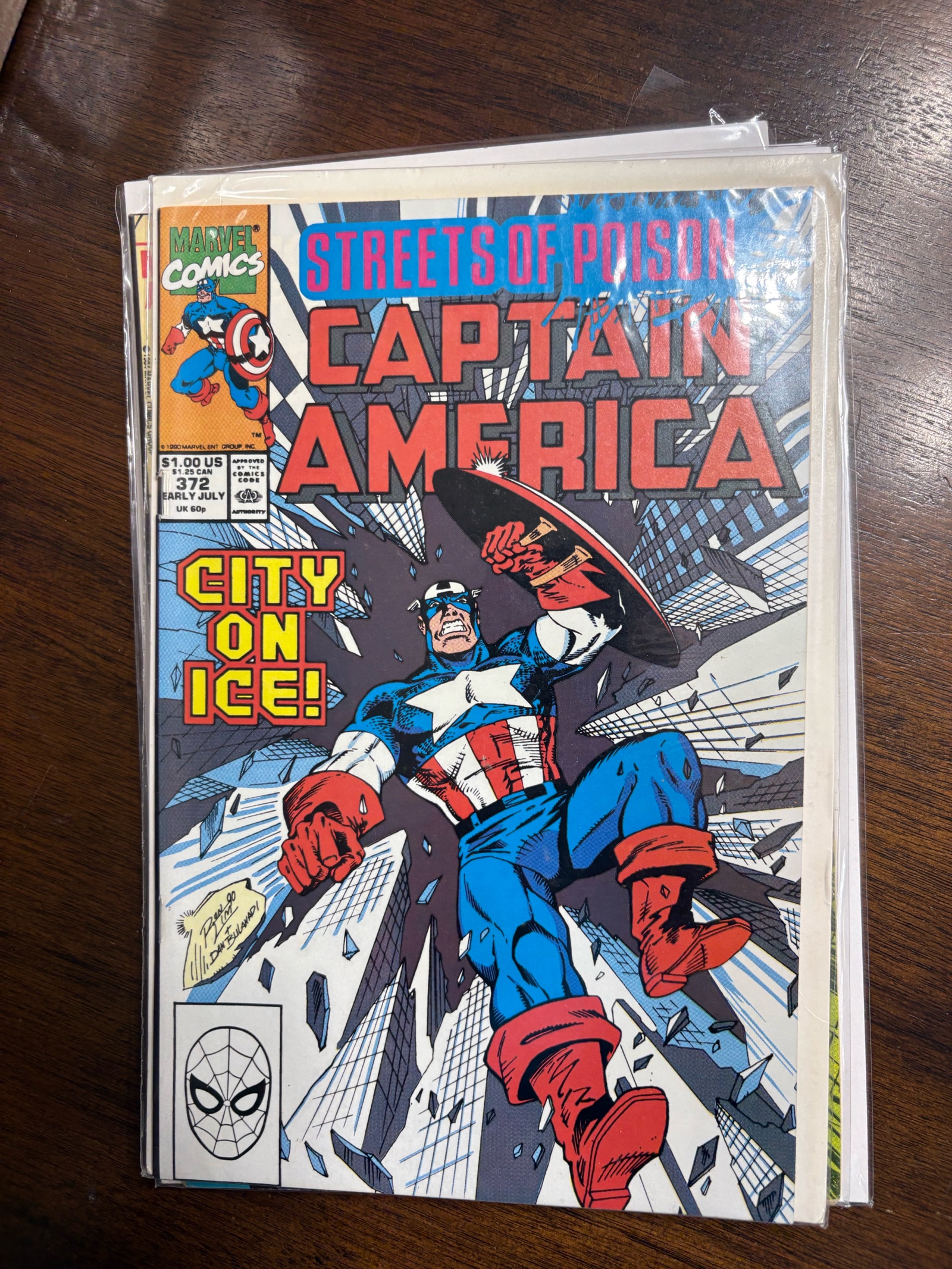 lot 152 image: Vintage Captain America Comic Book Streets of Poison City on Ice Issue #372