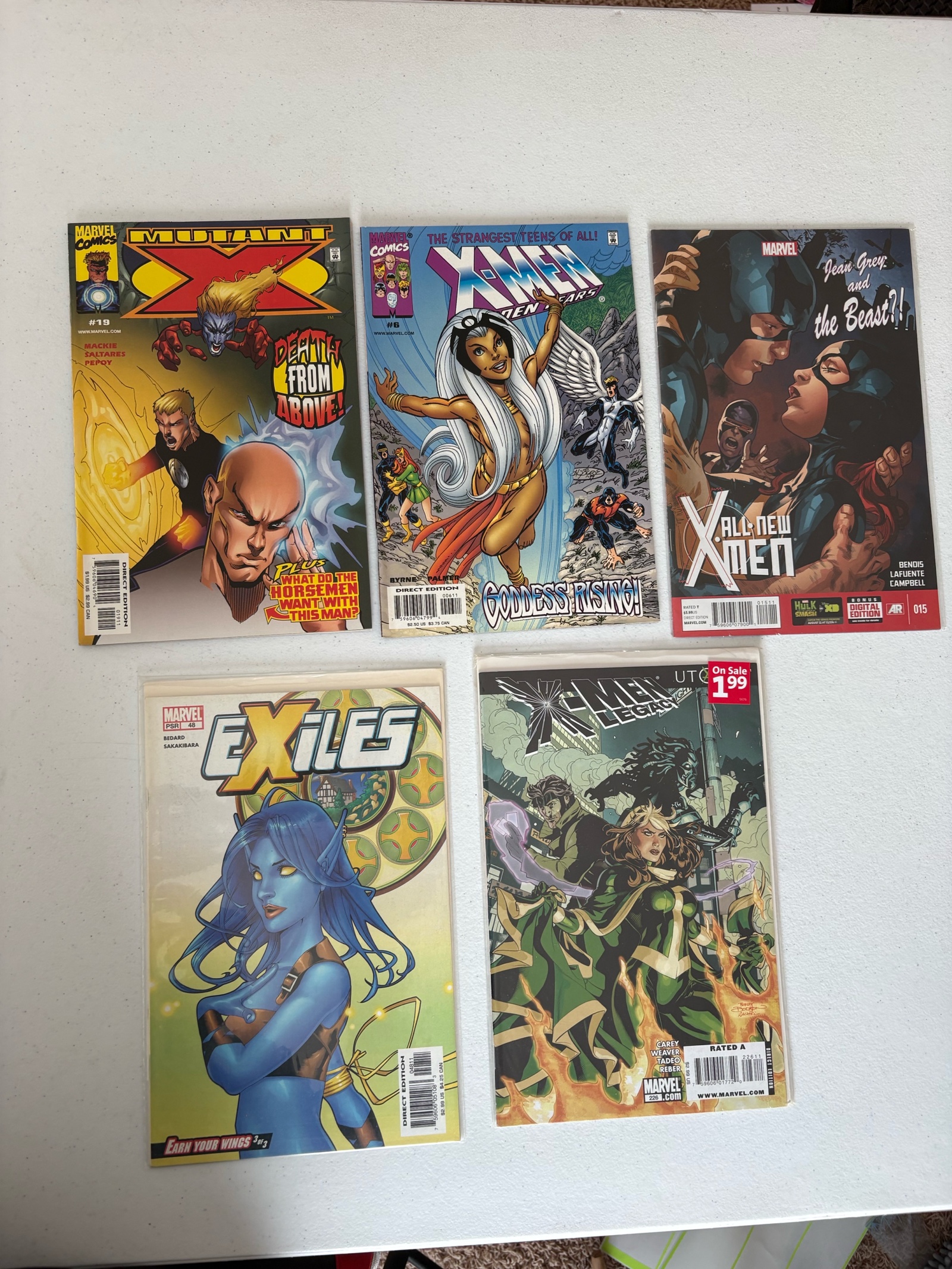 lot 238 image: X-Men Comic Book Lot Marvel, 5 Comics Mix of Different X-Men Series
