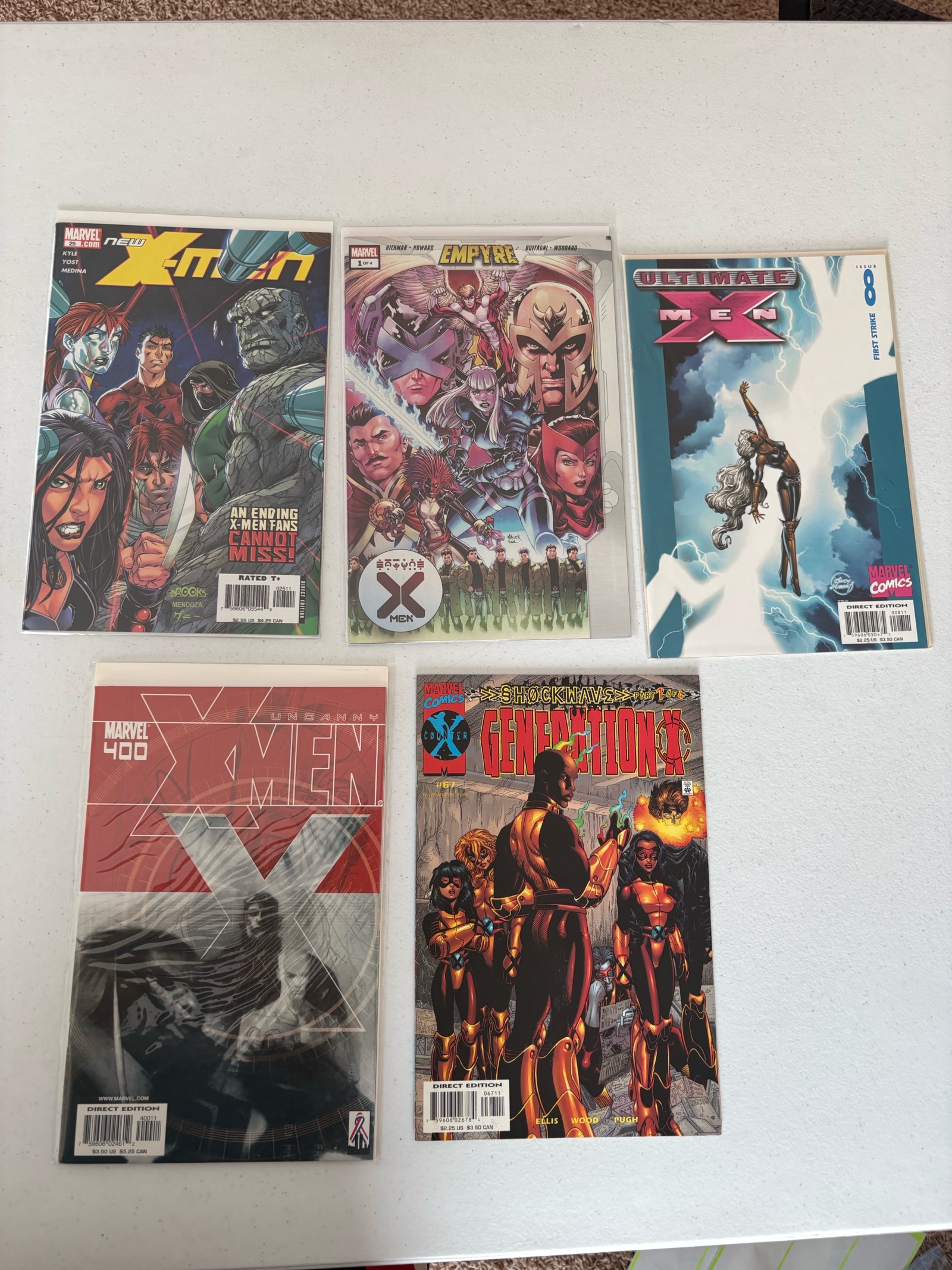 lot 239 image: X-Men Comic Book Lot Marvel, 5 Comics Mix of Different X-Men Series