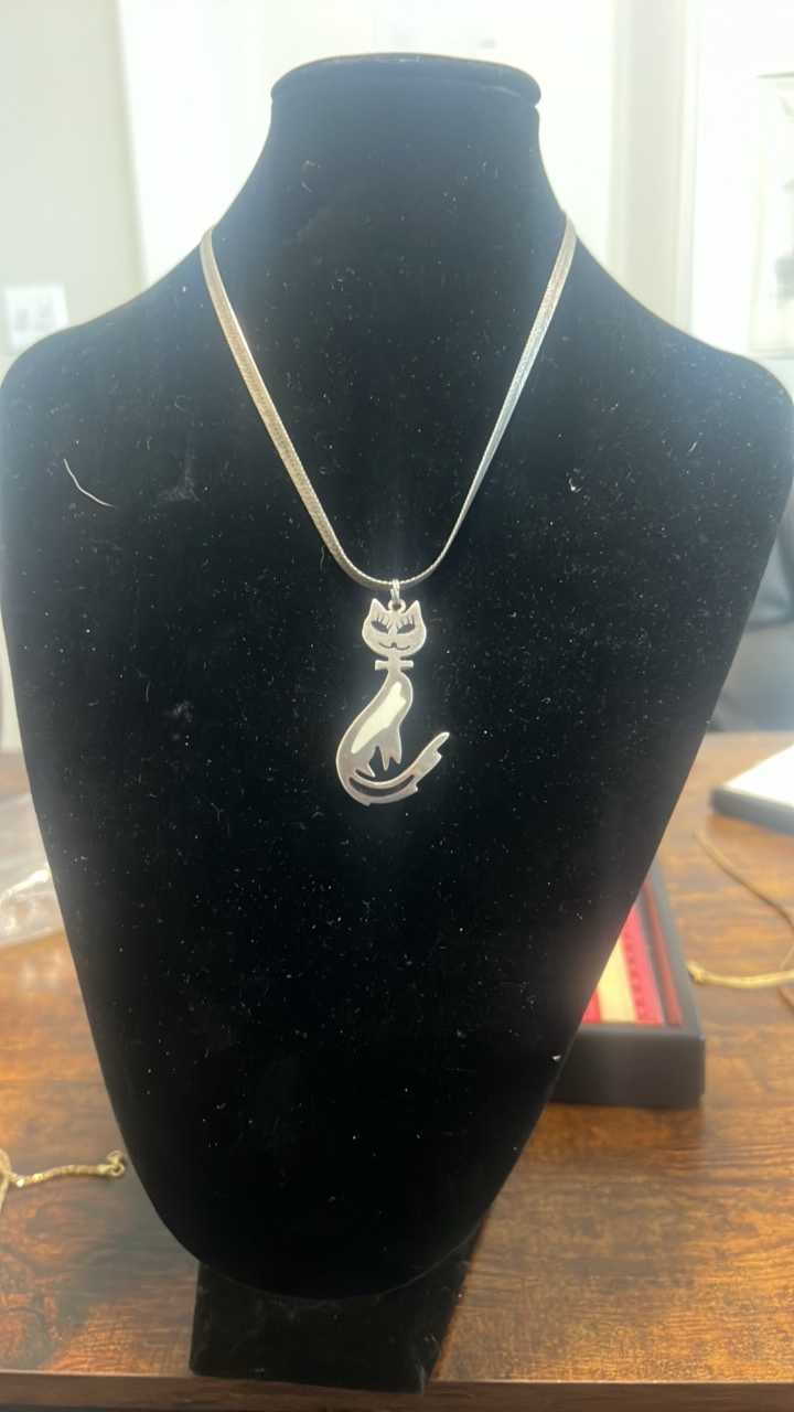 lot 101 image: Sterling cat pendant and necklace