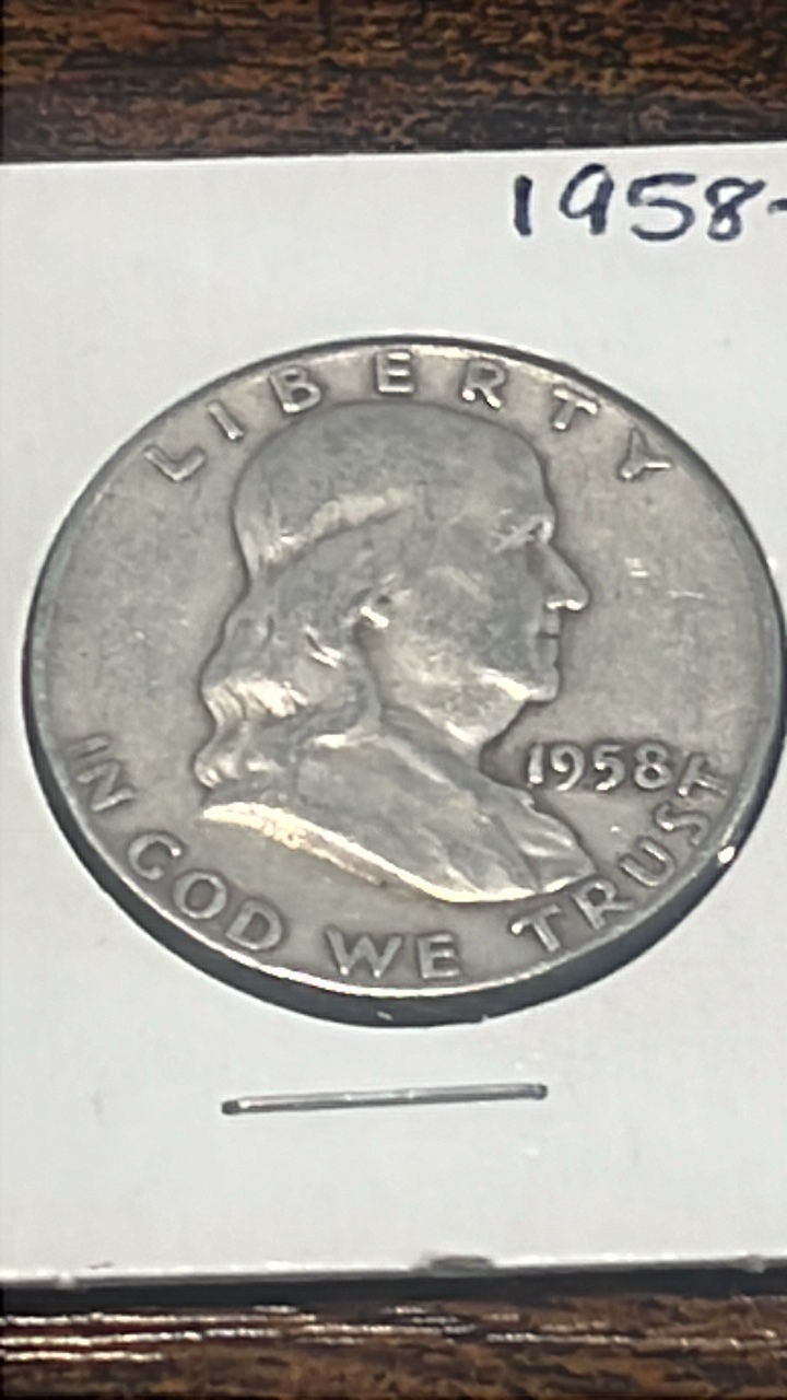 lot 24 image: 1958 d Benjamin Franklin half dollar