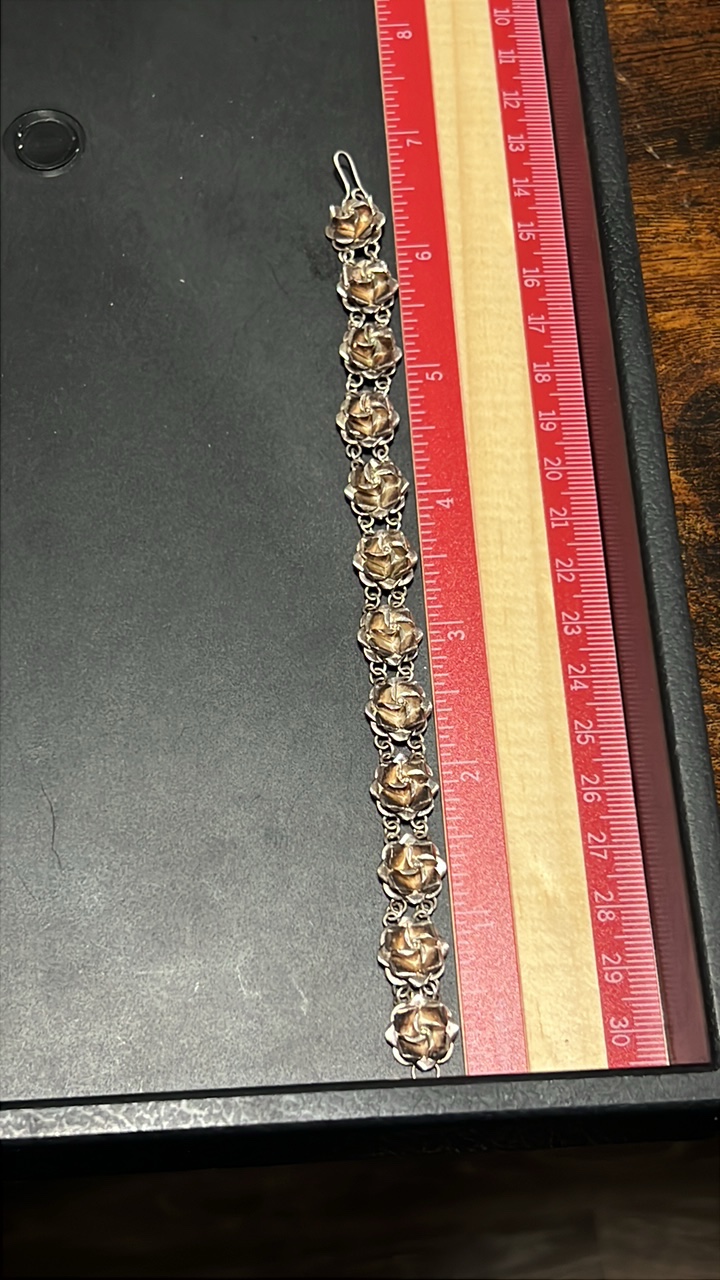 lot 97 image: Sterling silver rose bracelet