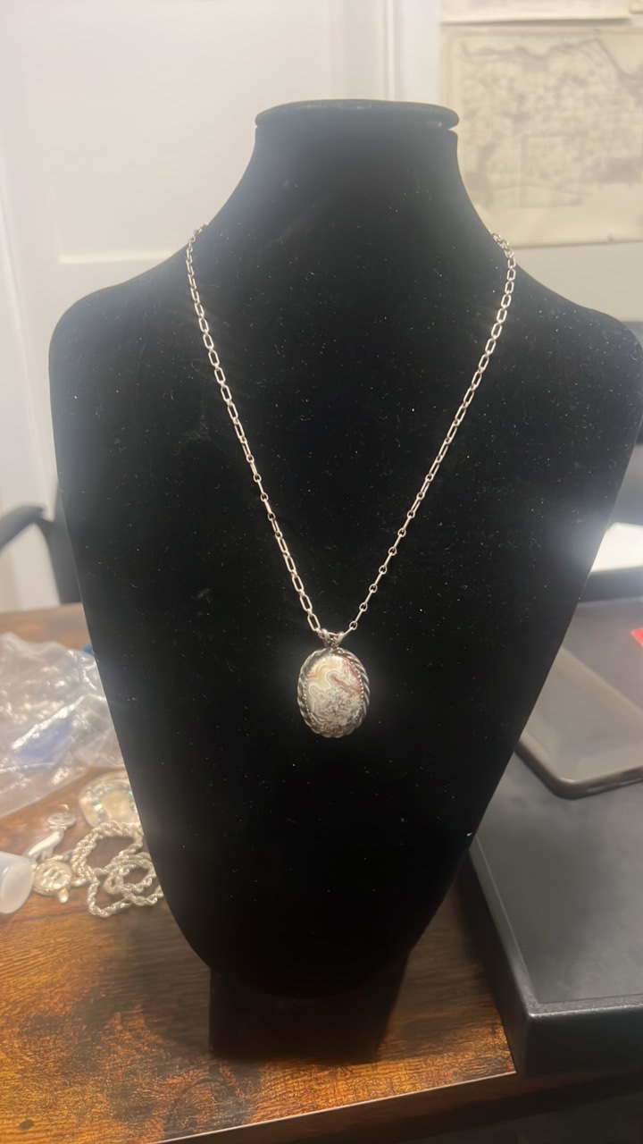 lot 98 image: Sterling silver pendant and chain