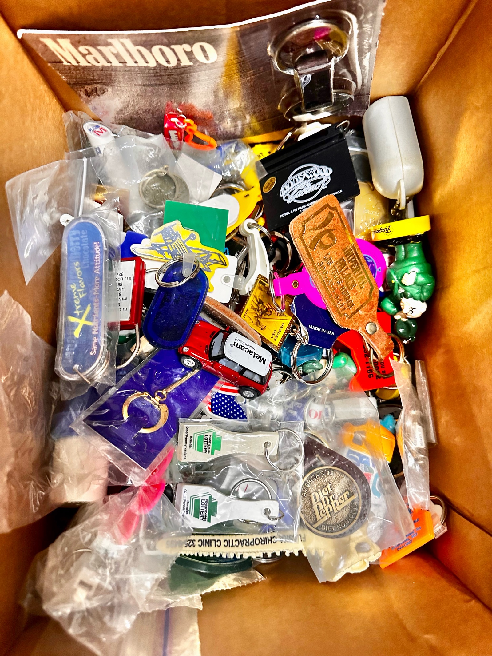 Box of vintage keychains