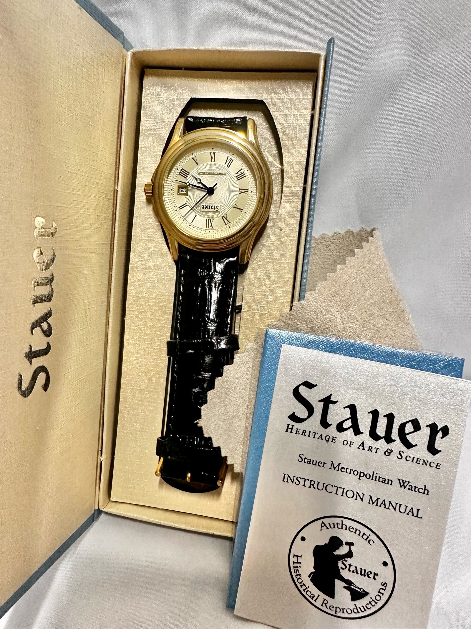 Stauer Metropolitan mens watch featuring a gold-finished case, antique ivory guilloche face