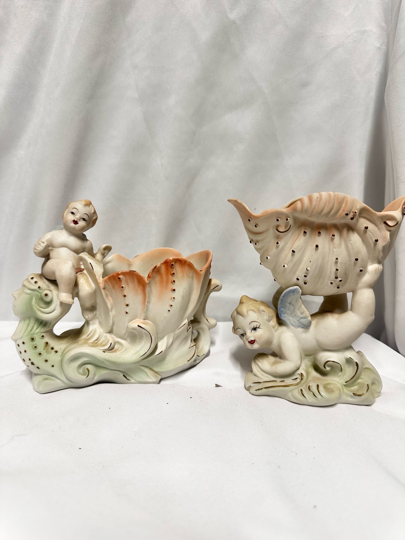 Two vintage bisque porcelain cherub or putti planters