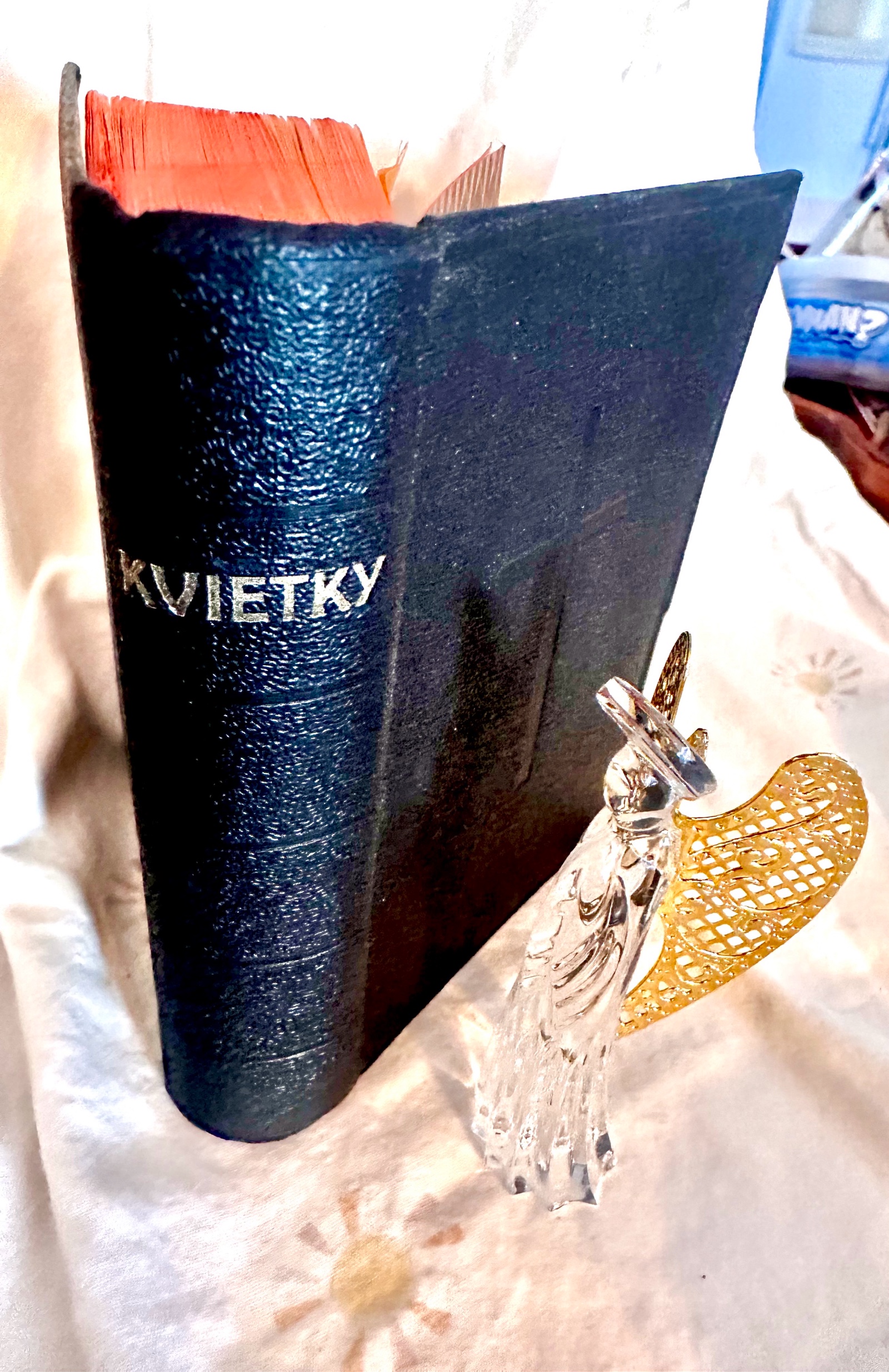 4 vintage items- Crucifix,crystal angel figurine, wooden saint, Kvietky book,