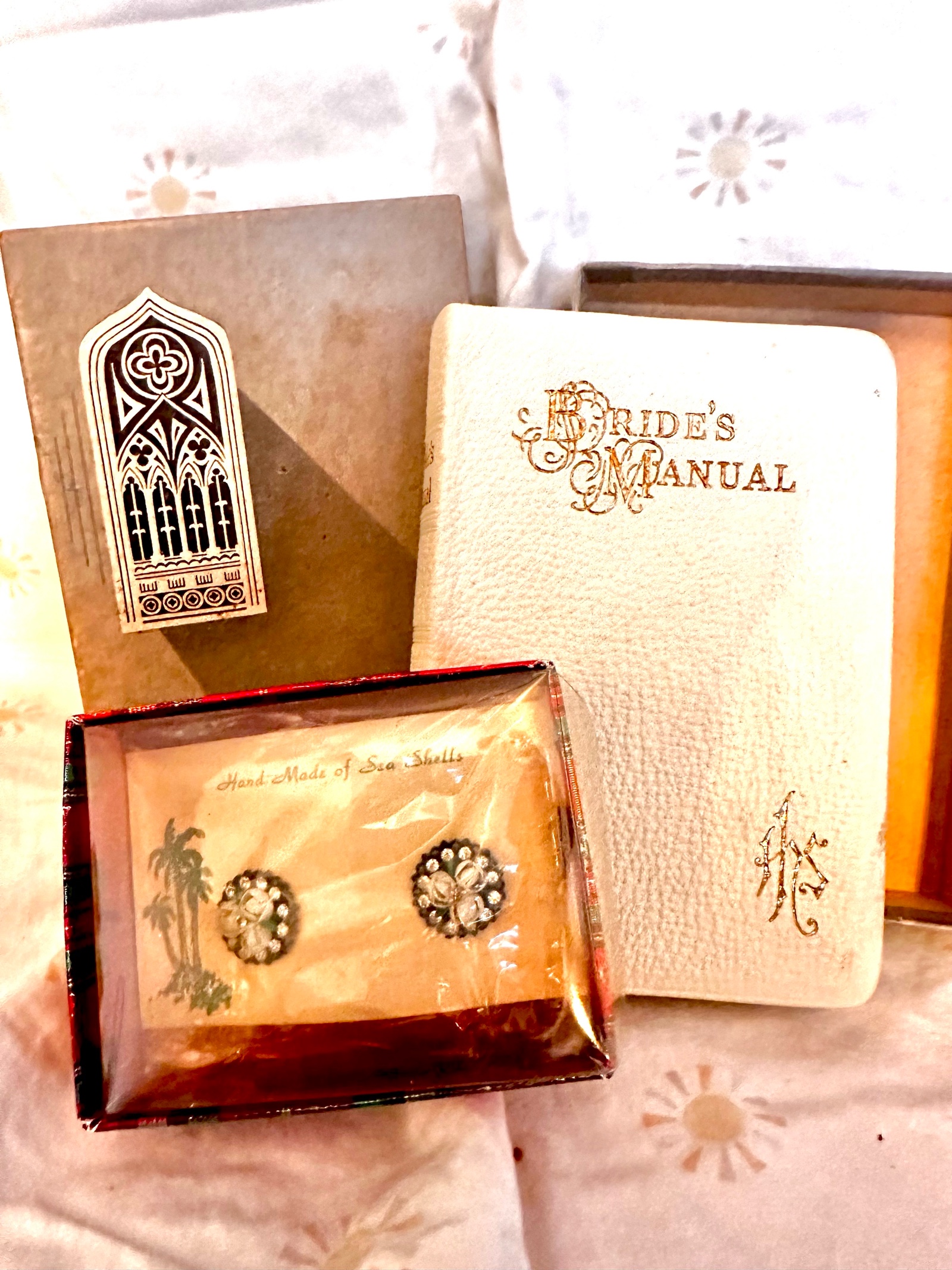 Vintage never used bridal book, coupled with vintage earrings