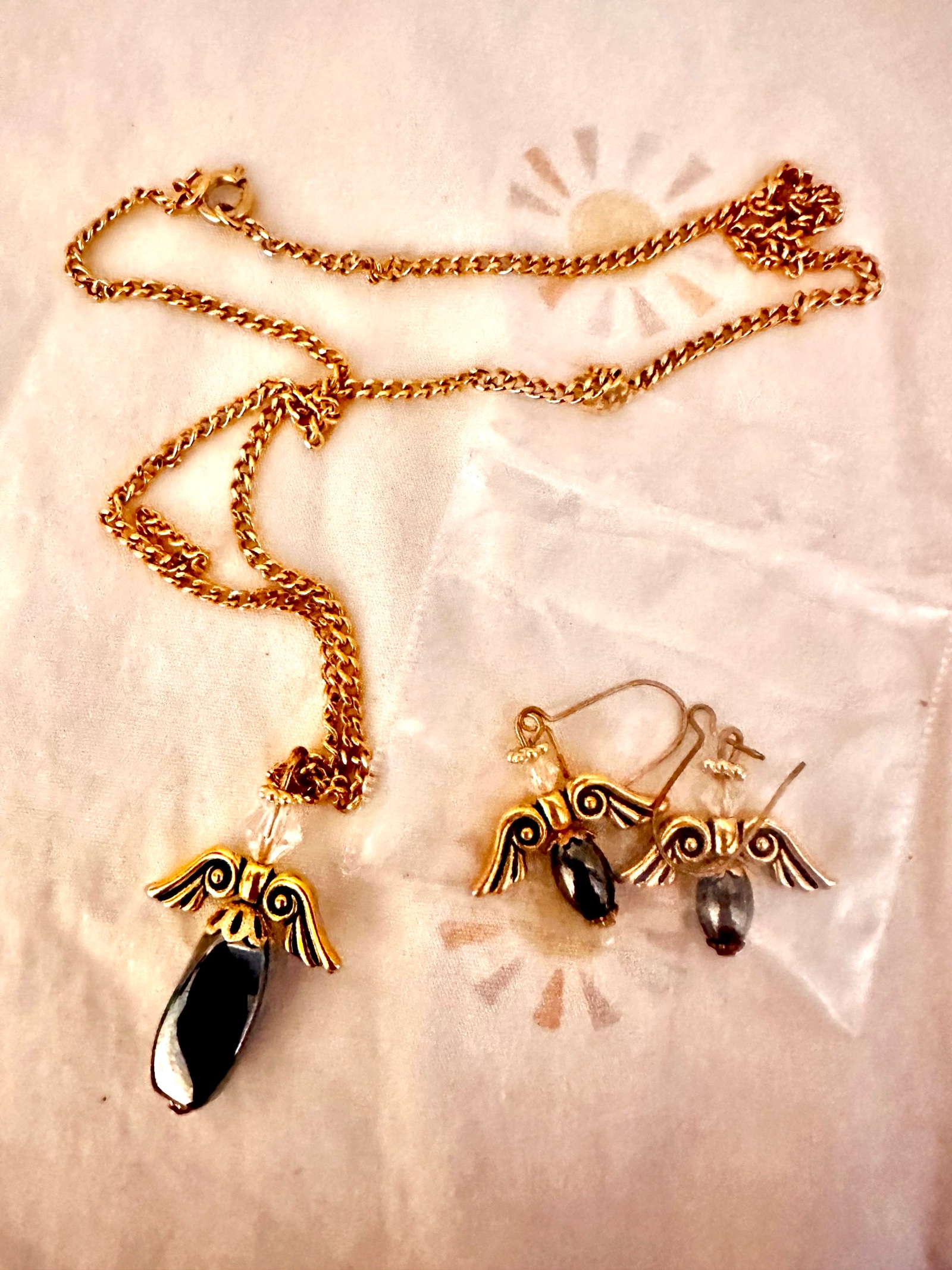 Angel themed jewelry set with earrings and necklace