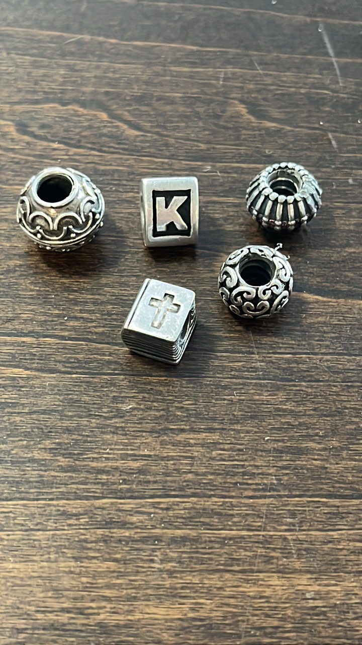 lot 15 image: Pandora 925 Sterling Silver ALE retired charms