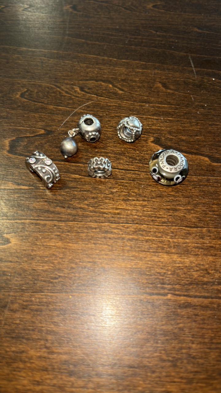 lot 17 image: 5 Retired Pandora 925 Ale Sterling Silver charms