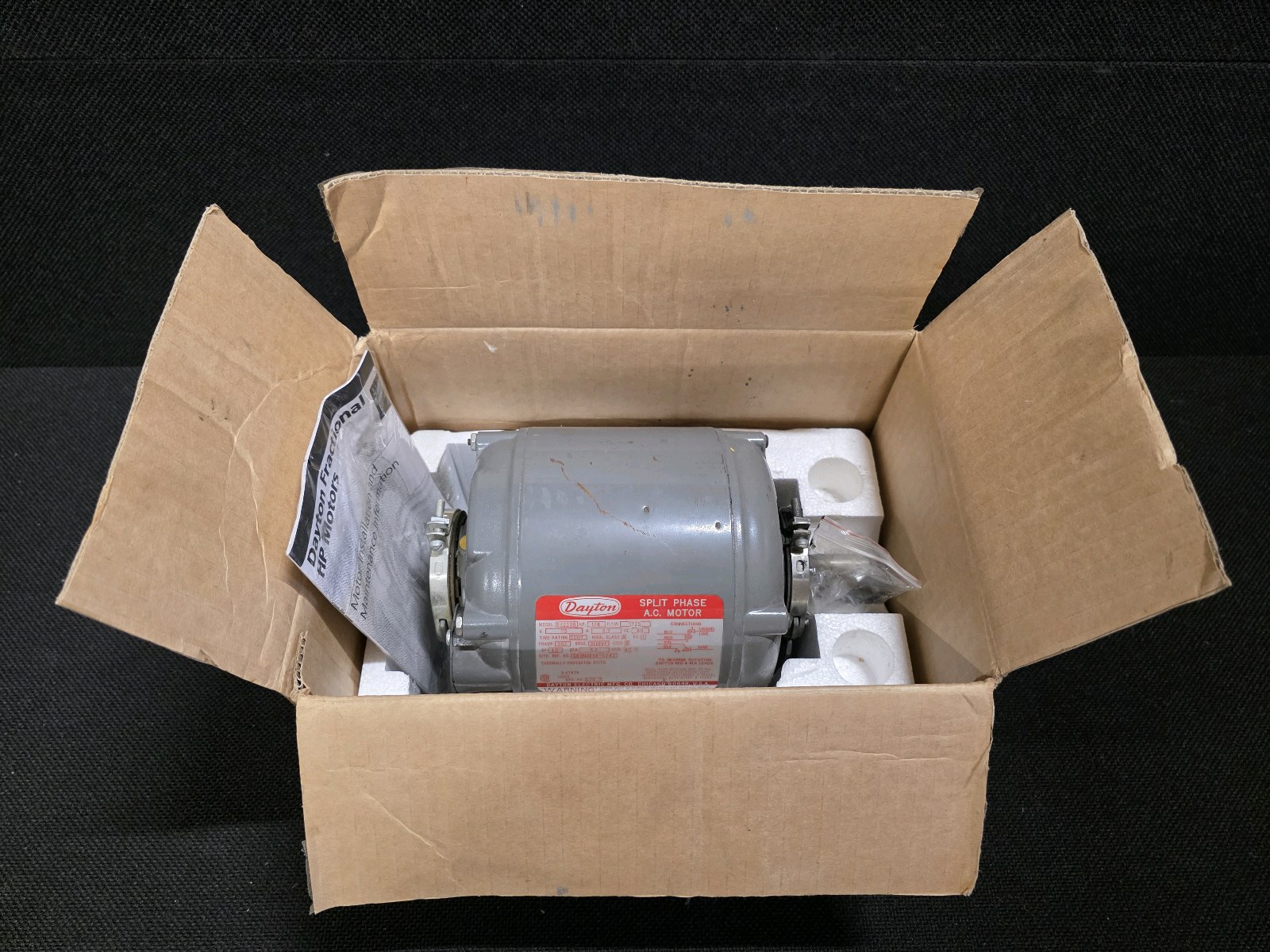 lot 105 image: Brand New Dayton Split Phase A.C. Motor