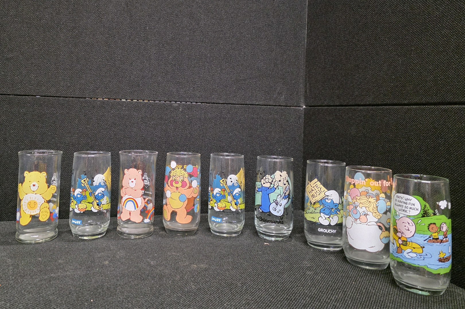 lot 116 image: VINTAGE Collectible 1980s Cartoon Drinking Glasses. Charlie Brown, Care Bears, etc.