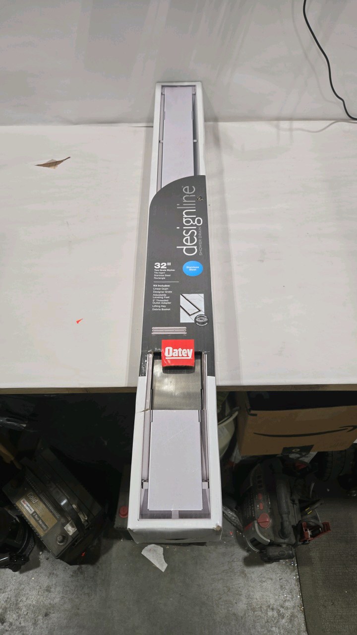 lot 115 image: Oatey Designline 32 in. Stainless Steel Linear Shower Drain with Tile-In Pattern Drain Cover