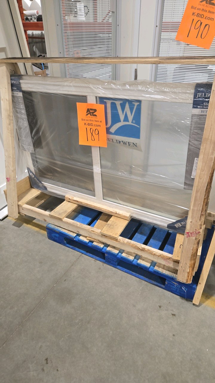 lot 189 image: JELD-WEN V-2500 Series 59.5 in. W x 35.5 in. H Left-Handed White Vinyl Low-E Sliding Window w Brickmould Nail Fin Frame