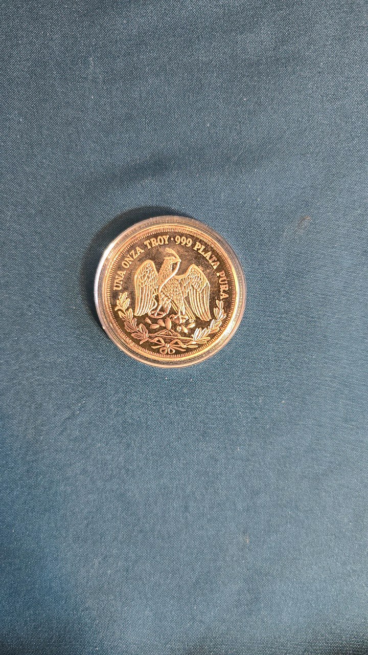 lot 17 image: 1 TROY OZ. SILVER MEXICAN ROUND OR MEDAL