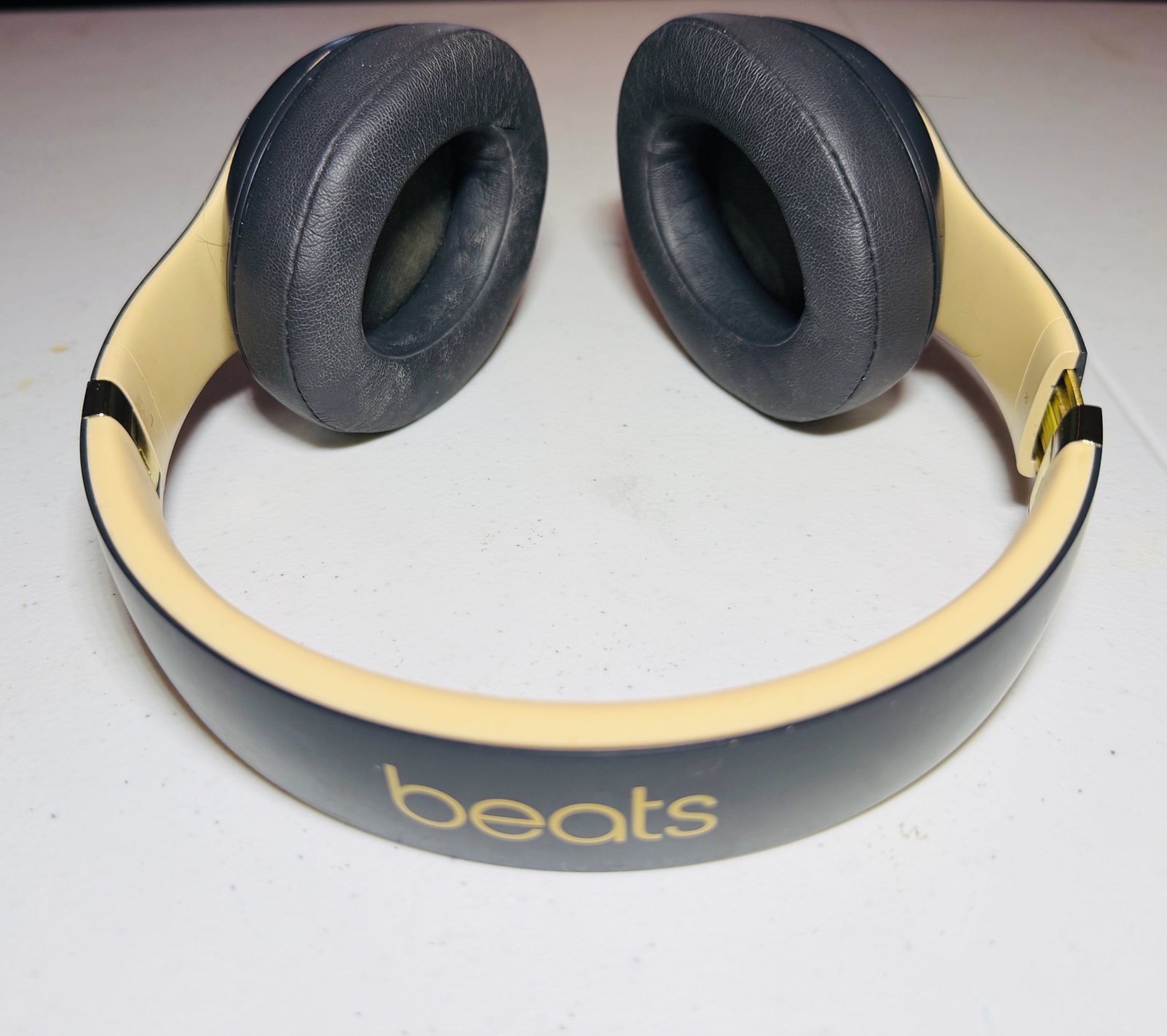 lot 107 image: BEATS Wireless Studio3 Noise Cancelling headphones grey & tan in color.