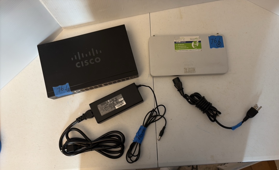 lot 120 image: CISCO Meraki MX65W router and 24-Port Gigabit Switch