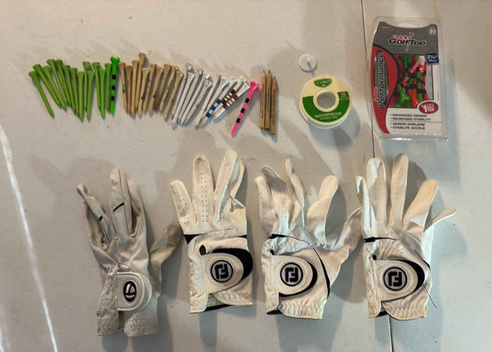 lot 18 image: FOOTJOY and TaylorMade golf gloves and tees