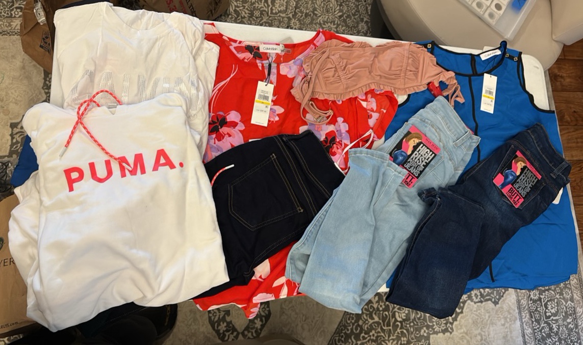 lot 91 image: CALVIN Klein tops, Puma sweatshirt, and Wax Jeans