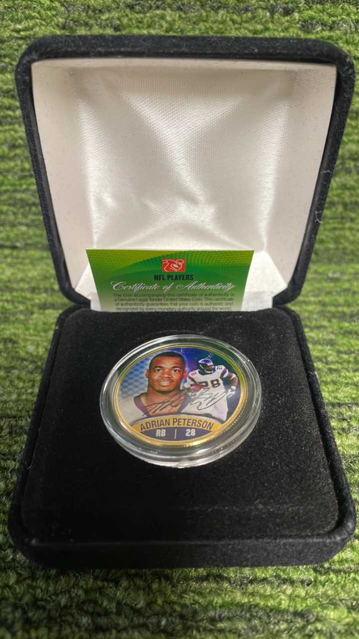 lot 103 image: Minnesota Vikings Adrian Peterson Gold plated half dollar
