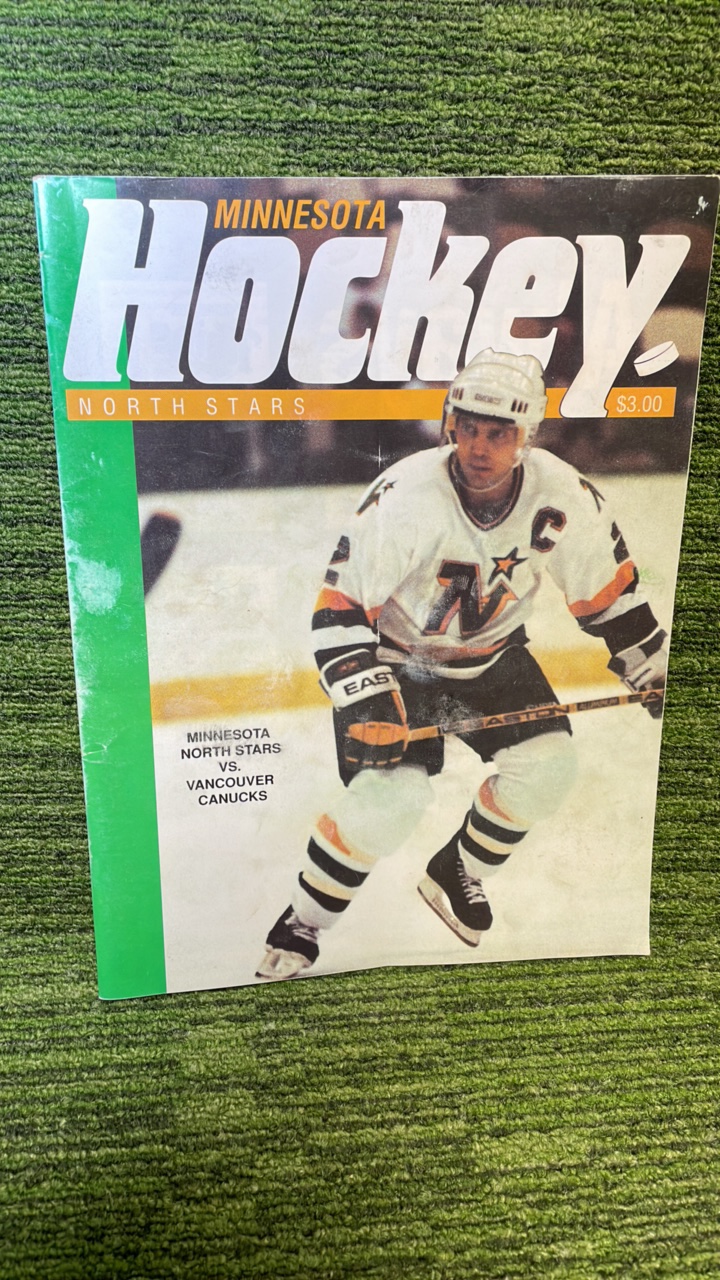 lot 166 image: 1990 November Minnesota hockey North Stars first Vancouver Canucks magazine