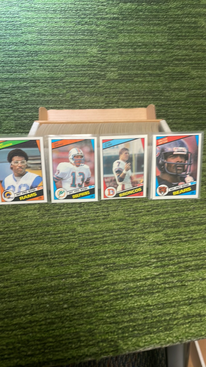 lot 211 image: 1984 Topps football set (#1-396) Sharp Set