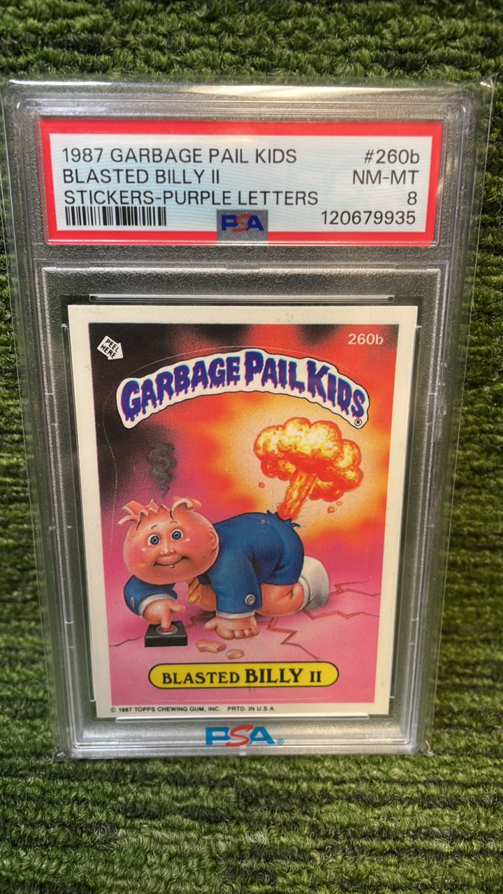 lot 42 image: 1987 Garbage Pail Kids Blasted Billy II Stickers, purple letters, PSA graded 8