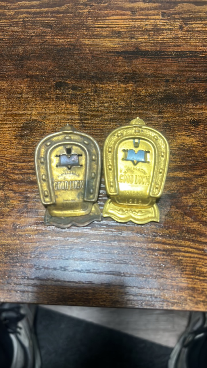 lot 109 image: 1869 good luck brass clips