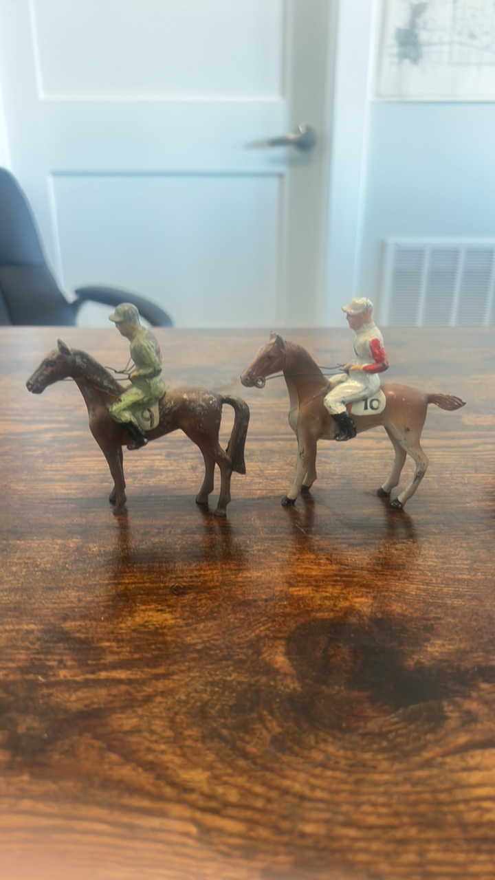 lot 28 image: cast iron horse racing toys