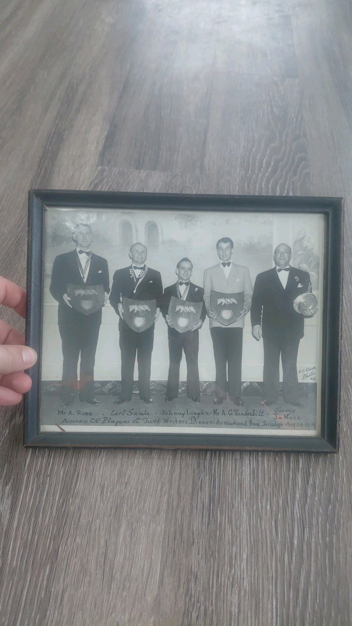 lot 39 image: 1939 photograph featuring Vanderbilt family member and horse racer alfred gwynne Vanderbilt as well as American jockey hall of famers johnny longden and earl sande