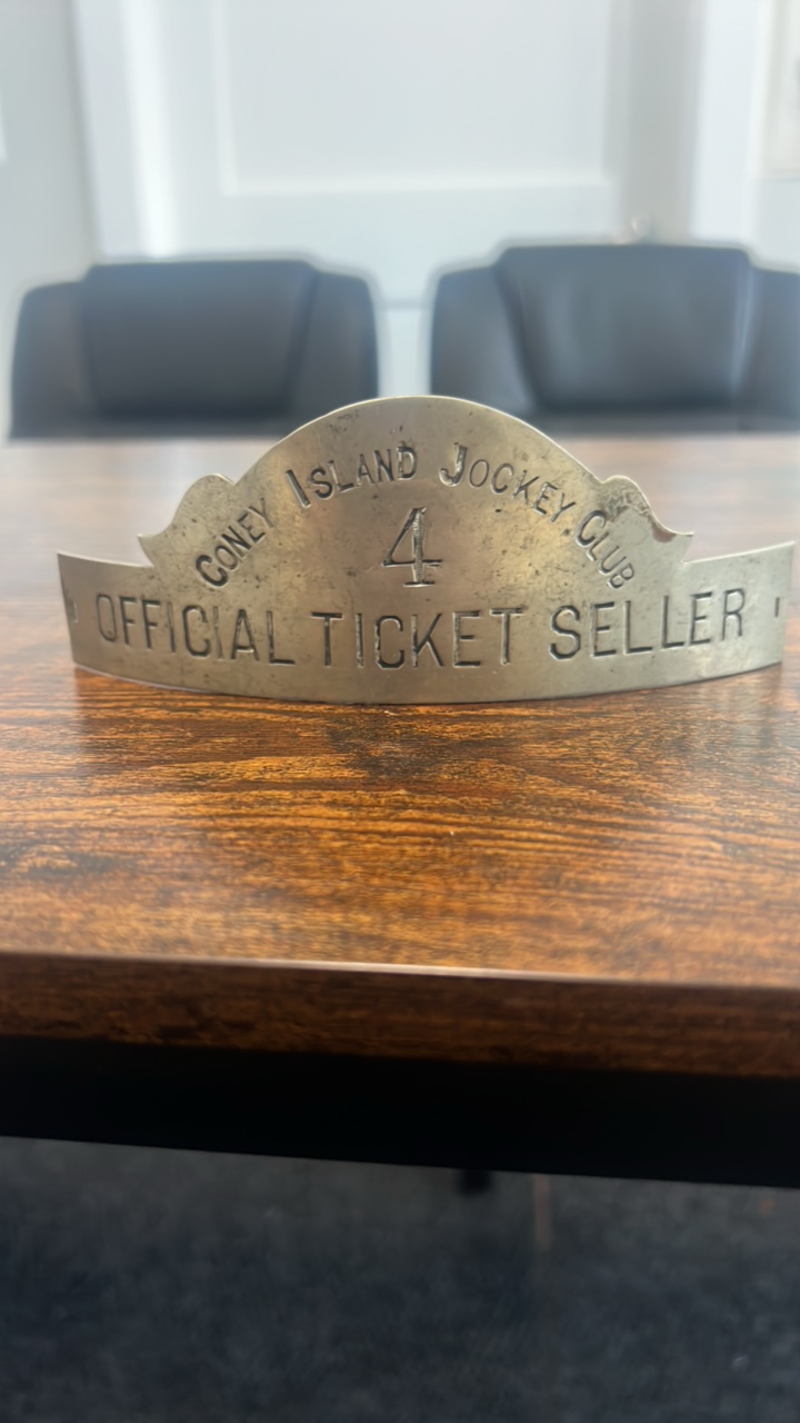 lot 95 image: antique Coney Island jockey club official ticket seller hat badge