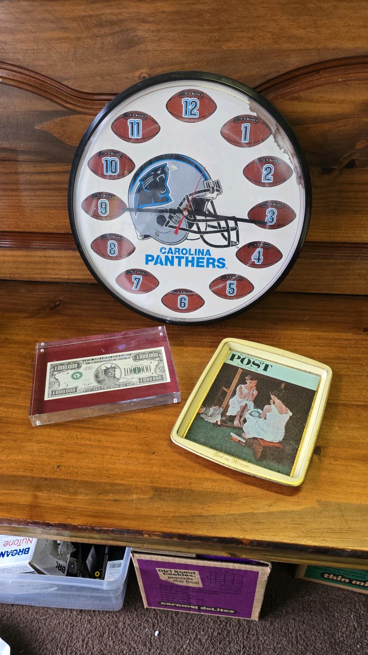 lot 106 image: Carolina Panthers Clock,  One Million Dollars encased, Girl In n Mirror Tin Plate