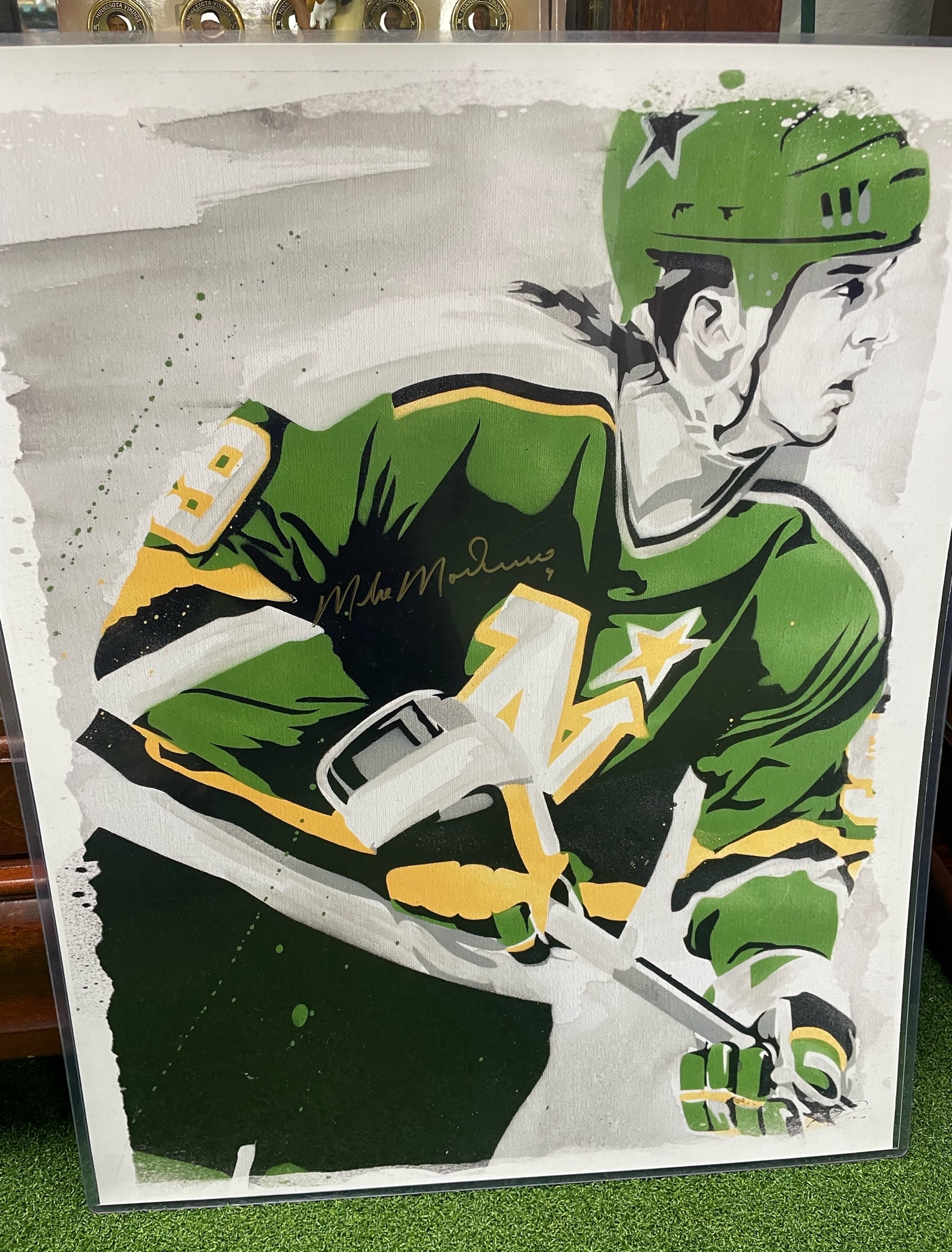lot 1 image: Mike Madano Minnesota North Stars Autographed 17X21 Poster with Authentication in holder-Very Cool Piece High Quality