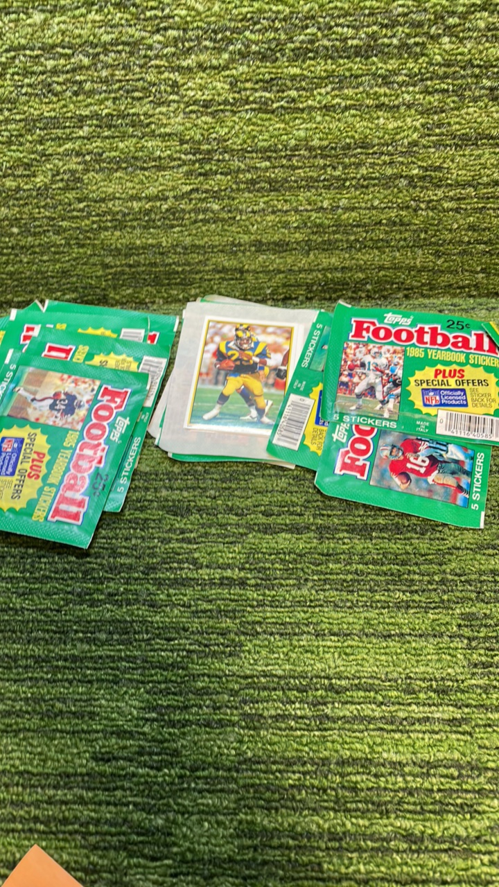 lot 174 image: 1985 Topps Football Yearbook Sticker packs, Seven unopened , few more open packs