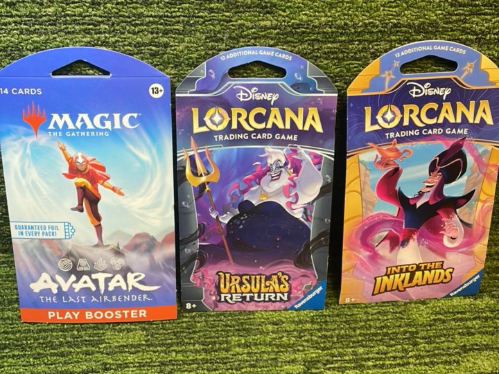 lot 265 image: Three unopened Hanger packs  One magic, 2 LORCANA Disney pack
